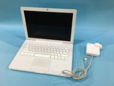 A fully working Apple Mac book, 2008, with power lead