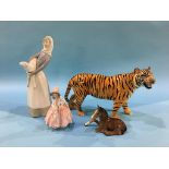 A Beswick standing tiger, a Royal Doulton figure 'Lily' HN1798 etc.