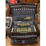 An Edwardian mahogany canteen of cutlery, with rising top and with two drawers to the front