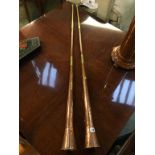 Two 19th century copper and brass hunting horns, 138cm length
