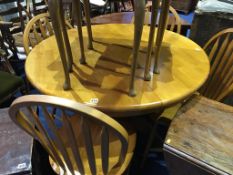 Modern circular table and four Windsor style chairs