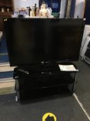 LG TV with remote and stand, 46"