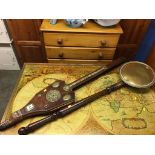 A long set of oak and brass mounted bellows and a brass warming pan, (bellows 117cm length)