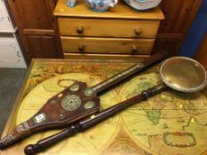 A long set of oak and brass mounted bellows and a brass warming pan, (bellows 117cm length)