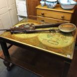 A Globe coffee table, with brass bands