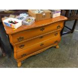 A small bombe style three drawer chest