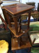 A set of three square top occasional tables