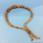A set of graduated beadwork amber coloured beads