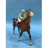 A Beswick horse and jockey, in pale green and pale yellow silks and numbered 24 on the saddle cloth