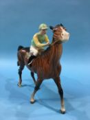 A Beswick horse and jockey, in pale green and pale yellow silks and numbered 24 on the saddle cloth