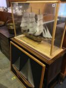 A cased model tall ship and three Nail and String Art pictures