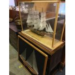 A cased model tall ship and three Nail and String Art pictures