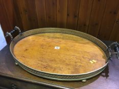 A large oak and brass galleried two handled tray, 69cm wide