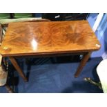 A 19th century mahogany fold over tea table