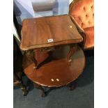 A mahogany circular coffee table and a small occasional table