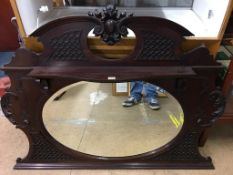 A mahogany oval mantel mirror 132 X 100CM APPROX