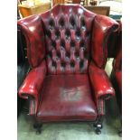 An oxblood Chesterfield high back armchair