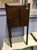 An Edwardian mahogany pot cupboard