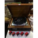 A teak cased table top Dynatron SRX 3OA record deck / amp and tuner