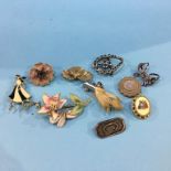 Ten decorative brooches