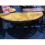 A Victorian walnut half moon hall table, with heavily carved base, 147cm wide x 54cm deep
