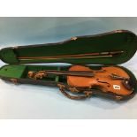 A child's violin, with bow and case