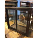 A shop counter display cabinet with sliding doors, 66cm wide x 33cm deep