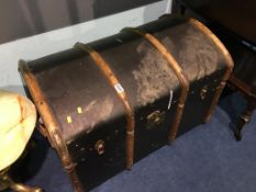 A domed top travel trunk