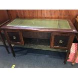 A mahogany desk, with inset leather top