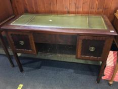 A mahogany desk, with inset leather top