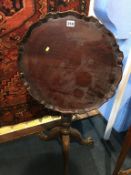 Reproduction mahogany tilt top tripod table