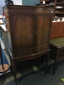 A walnut drinks cabinet