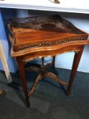 Reproduction mahogany occasional table, with pierced gallery