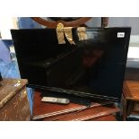 Isis 31" flatscreen TV, with remote and instructions