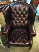 Oxblood leather Chesterfield wing back armchair, Seat height 40cm x 47cm wide x 55cm deep, 107cm