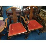 Pair of walnut ball and claw carver chairs