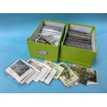 A collection of various postcards, in two boxes