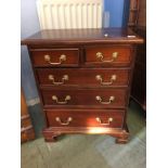 A small mahogany chest of five drawers, 54cm x 30cm x 67cm