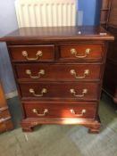 A small mahogany chest of five drawers, 54cm x 30cm x 67cm