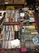 Four trays of CDs and DVDs