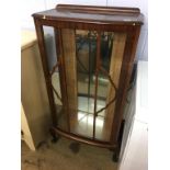 Walnut china cabinet and a standard lamp.