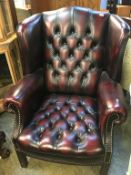 Oxblood leather Chesterfield wing back armchair