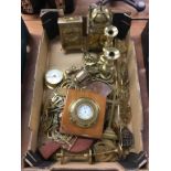 Assorted brassware including silver pocket watch in a brass mount, candle sticks etc.