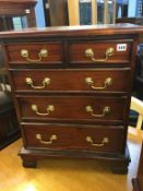 Small reproduction mahogany chest of five drawers, 56cm x 32cm x 68cm