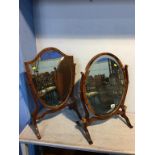 Two mahogany swing mirrors