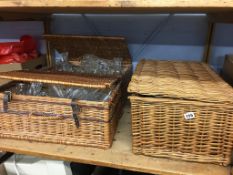 Three wicker hampers, containing assorted glass ware