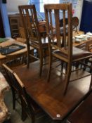 Mahogany extending table and set of six dining chairs