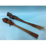 Two carved African fly swats