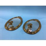 Pair of mirrored brass wall sconces