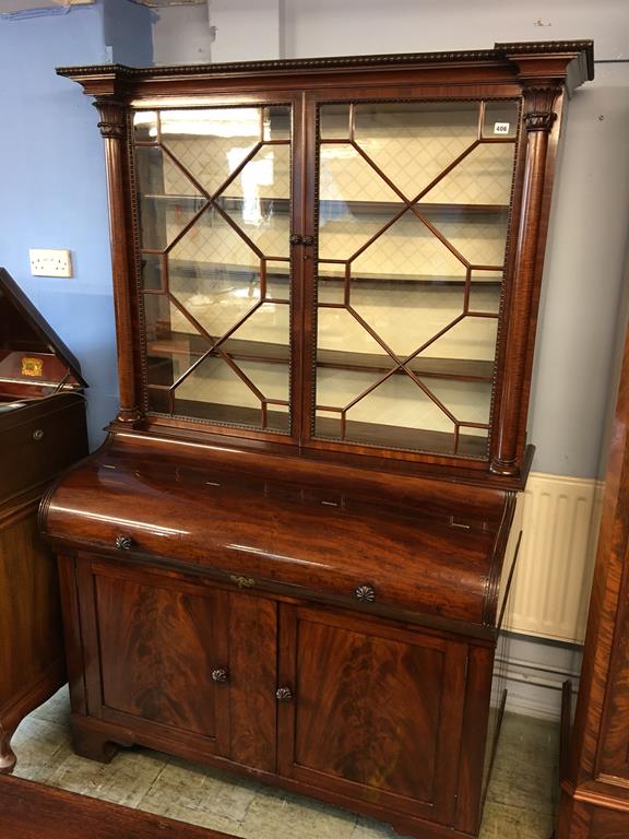 A mahogany cylinder bureau bookcase, 132cm wide x 67cm deep x 196cm high